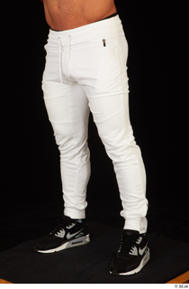 Dave black sneakers dressed leg lower body white pants 0002.jpg